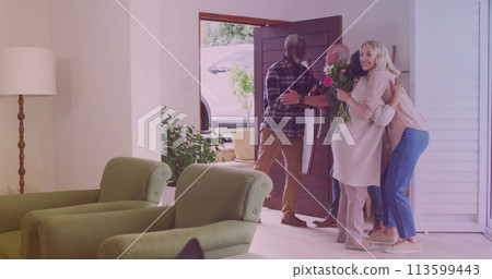 Senior Caucasian man welcomes diverse couple at home 113599443