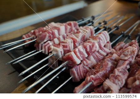 Fresh raw lamb skewers in restaurant Fresh raw lamb skewers in restaurant 113599574