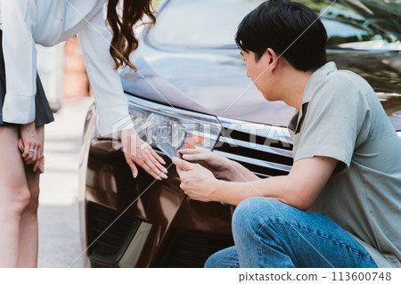Car accident claim representative examining the accident with young Asian female driver talking with on the road Car accident claim representative examining the accident with young Asian female driver talking with on the road 113600748