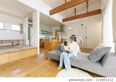 Parents and children relaxing in the living room Parents and children relaxing in the living room 113601212