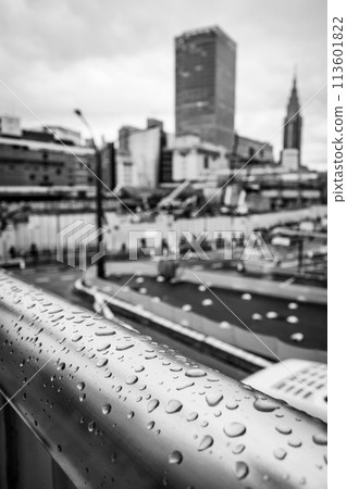Raindrops on a pedestrian bridge Tokyo Shinjuku Station West Exit under redevelopment 2024.04 c-4 monochrome 113601822