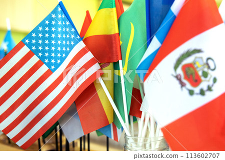 Close-up on the flags of Peru and the USA against the background of other flags of the world. 113602707
