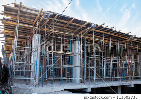 Construction site with scaffolding and floor formwork. Construction site with scaffolding and floor formwork. 113602735
