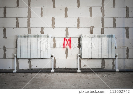 Building Construction Progress: Heating Radiators Installed in Rough Finish. 113602742