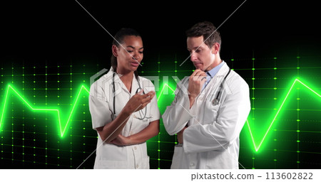 Image of life line over two diverse doctors on black background Image of life line over two diverse doctors on black background 113602822