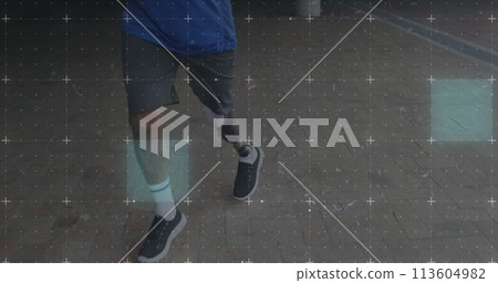Biracial man with a prosthetic leg walks outdoors 113604982