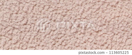 Texture of beige fluffy woolen textile background from soft fleecy material, macro. Structure of brown fabric 113605225