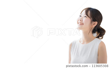 Young woman wearing a white tank top looking up Young woman wearing a white tank top looking up 113605308
