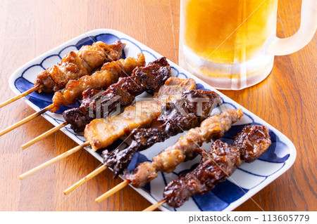 Assorted yakitori and draft beer 113605779