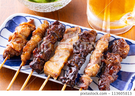 Assorted yakitori and draft beer 113605813