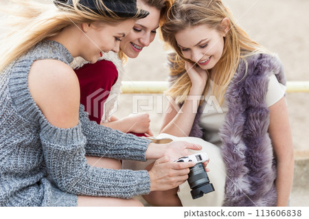 Photographer showing fashion models photos Photographer showing fashion models photos 113606838