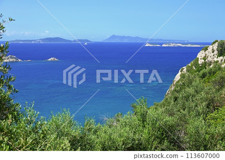 Beautiful beach with sea, sun and blue sky. Concept for travel and summer vacation. Greece-island of Corfu. 113607000