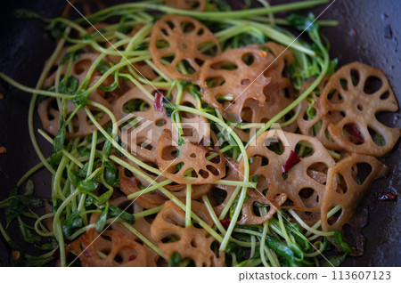 Spicy stir-fried pea sprouts and lotus root Spicy stir-fried pea sprouts and lotus root 113607123