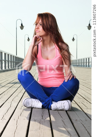 Attractive girl Young woman pier sea 113607266