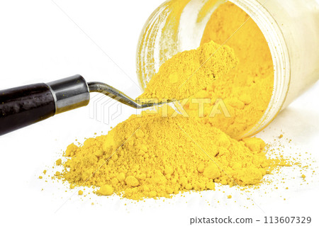cadmium yellow light, dry paint on a white background, macro cadmium yellow light, dry paint on a white background, macro 113607329
