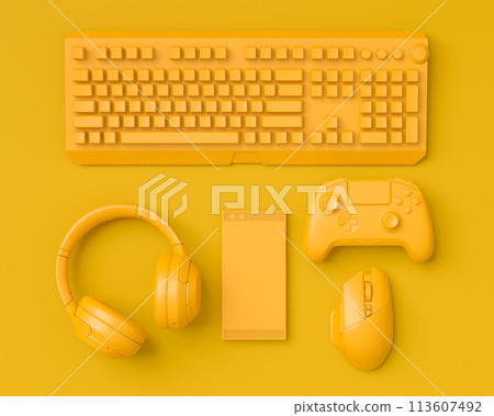 Modern home office setup featuring keyboard, gaming controllers and headphones 113607492