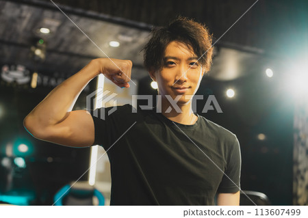 man in black t-shirt 113607499