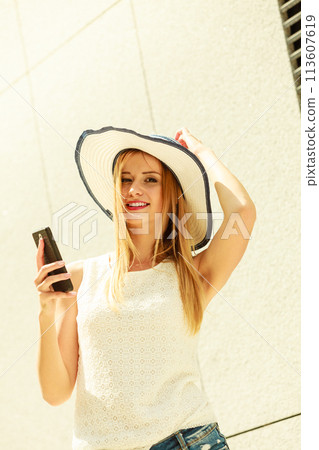 Girl using mobile phone texting on smartphone Girl using mobile phone texting on smartphone 113607619