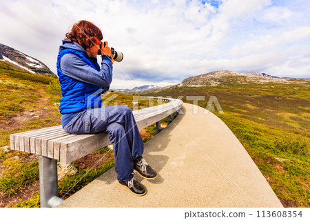 Woman on Vedahaugane rest stop, Norway Woman on Vedahaugane rest stop, Norway 113608354