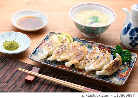 Dumplings and Chinese soup 113609697