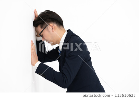 Middle-aged businessman worried about poor health Middle-aged businessman worried about poor health 113610625