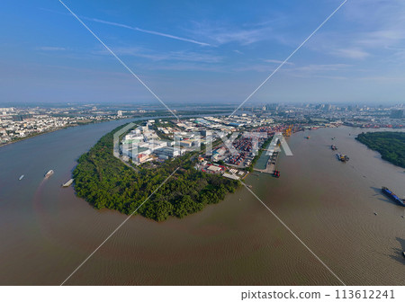 Aerial view from drone of Ho Chi Minh city port, canal system for traffic waterway on Saigon river, crane and container at riverside harbor, logistic for export, import industrial with cheap expense 113612241