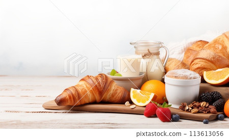 Delectable continental breakfast with croissant and Berries 113613056