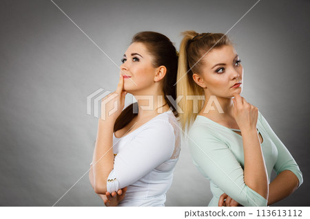 Two women thinking about something Two women thinking about something 113613112