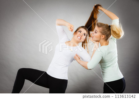 Two agressive women having argue fight 113613142
