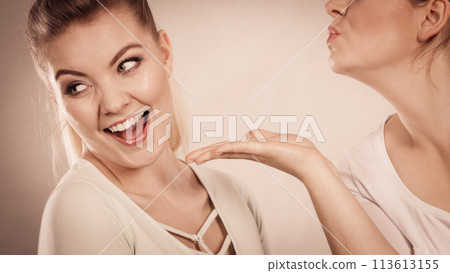 Happy women sending air kisses 113613155