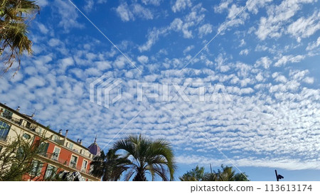 Climax clouds spreading across a clear blue sky 113613174