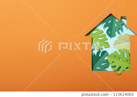 The house is cut out of paper with paper leaves The house is cut out of paper with paper leaves 113614003