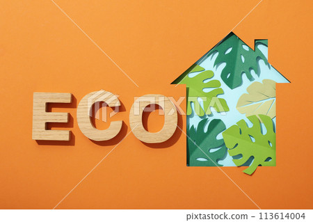 The house is cut out of paper with paper leaves The house is cut out of paper with paper leaves 113614004
