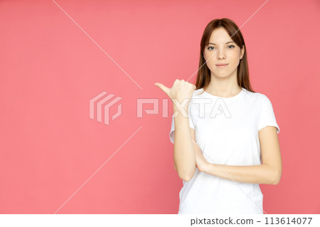 An attractive young girl on a plain background 113614077
