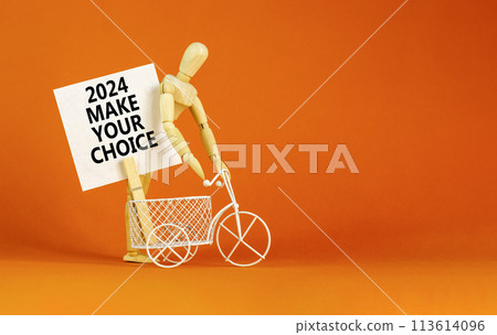 2024 Make your choice symbol. Concept words 2024 Make your choice on beautiful white paper on clothespin. Bicycle model. Beautiful orange background. Business 2024 Make your choice concept. Copy space 2024 Make your choice symbol. Concept words 2024 Make your choice on beautiful white paper on clothespin. Bicycle model. Beautiful orange background. Business 2024 Make your choice concept. Copy space 113614096