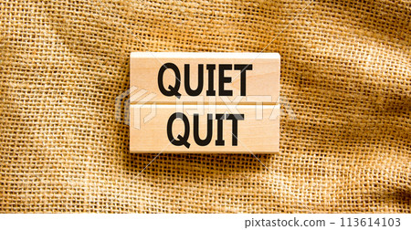 Quiet quit symbol. Concept words Quiet quit on wooden blocks. Beautiful canvas table canvas background. Business and quiet quit concept. Copy space. 113614103