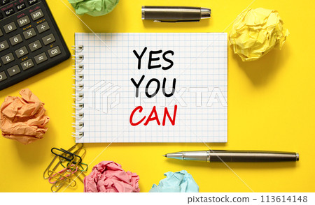 Motivational Yes you can symbol. Concept words Yes you can on beautiful white note. Beautiful yellow background. Black pen. Calculator. Business motivational and Yes you can concept. Copy space 113614148