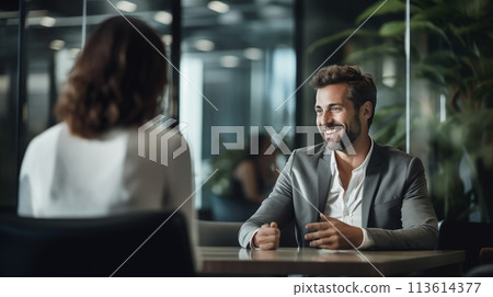 Business executives casually converse in a relaxed office ambiance 113614377