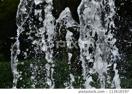 Splashing fountain water movement close-up 113616597