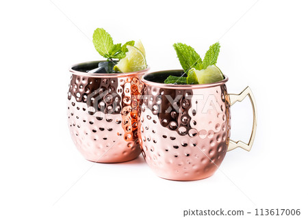 Moscow mule cocktail served with ice and slice of lime isolated on white background Moscow mule cocktail served with ice and slice of lime isolated on white background 113617006