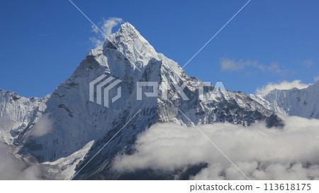 Snow capped peak of Mount Ama Dablam surrounded by clouds, Nepal. Snow capped peak of Mount Ama Dablam surrounded by clouds, Nepal. 113618175