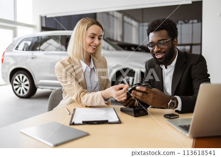 Young woman paying with electronic credit card at terminal. 113618541