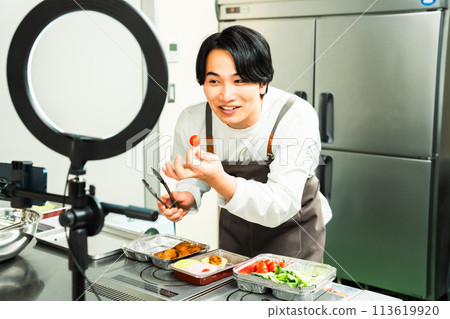 Male influencer filming a video 113619920