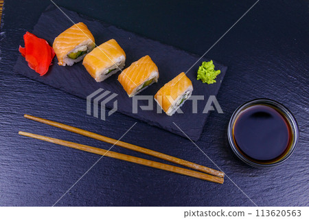 Sushi rolls Philadelphia on a black slate. Top view Sushi rolls Philadelphia on a black slate. Top view 113620563