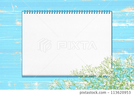 A shabby blue wooden deck with a sketchbook and baby's breath A shabby blue wooden deck with a sketchbook and baby's breath 113620953