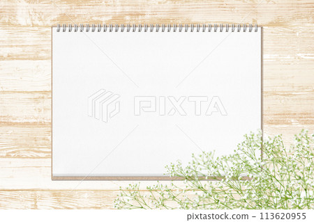 A shabby white wooden deck with a sketchbook and baby's breath A shabby white wooden deck with a sketchbook and baby's breath 113620955
