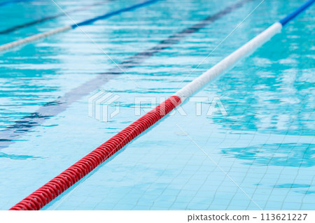 competition pool with blue water and marked swimming lanes 113621227