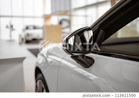 Side mirror on white car. Side mirror on white car. 113621500