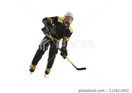 Competitive young man, hockey player in black uniform training, playing isolated on white background Competitive young man, hockey player in black uniform training, playing isolated on white background 113621642