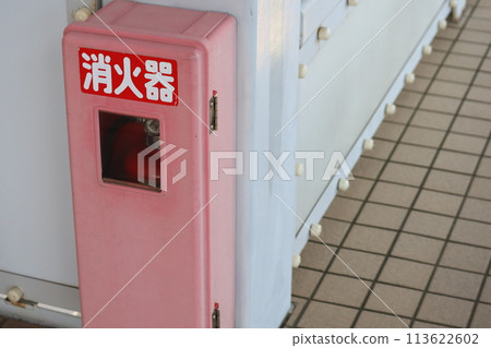 A box containing a fire extinguisher A box containing a fire extinguisher 113622602